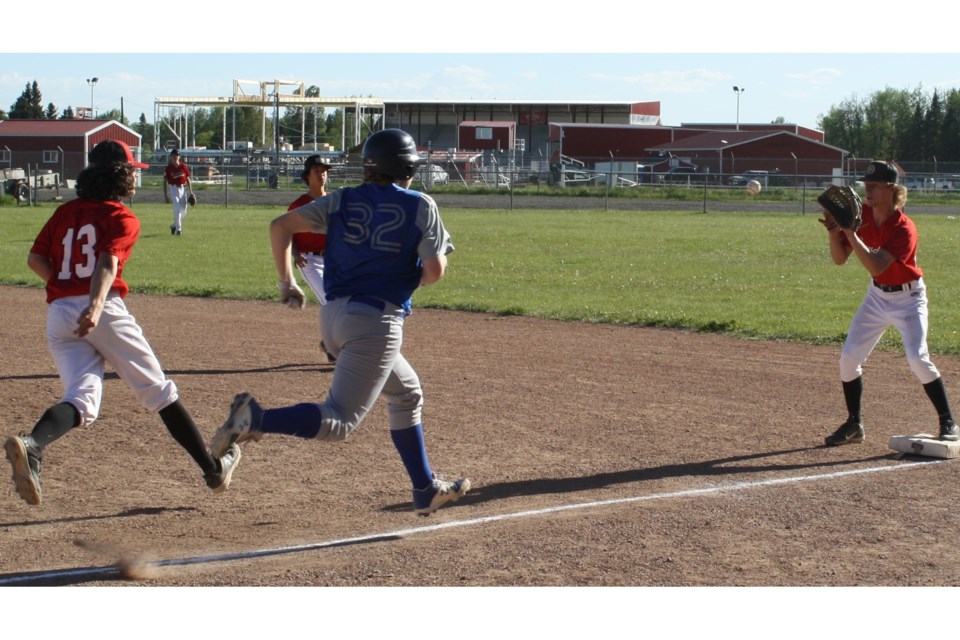 Chase Bergen, left, who was Sundre’s starting pitcher, makes a quick toss to first baseman Parker Rosevear for an out with second baseman PJ Vardas in the background keeping an eye on the play. Simon Ducatel/MVP Staff