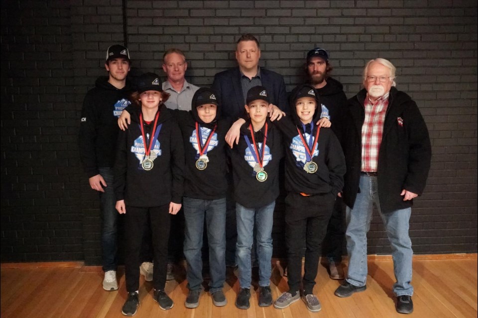 Back row, from left: Jaydon Braybrook, Rick Liwczak, U13 Huskies head coach Aaron Johnson, Tyler Mahan and Tim Kennedy, president of the Sundre Minor Hockey Association. Front row, from left: Brady Smith, most valuable player; Carson Nault, Ironman Award; Justin Liwczak, most improved; and Tylan Mahan, sportsmanship award. 
Photo courtesy of SMHA 