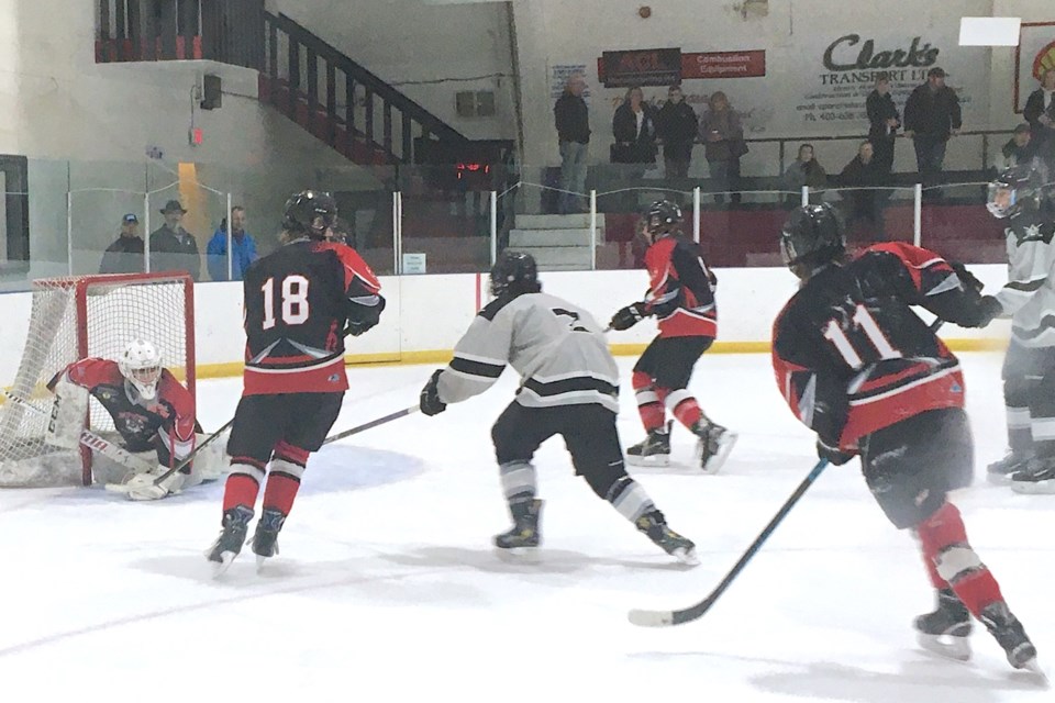 The Huskies’ netminder was on the ball – or perhaps rather, the puck – Friday, Jan. 26 during the team’s opening game of their annual home tournament fundraiser at the Sundre Arena, which was played against the Taber Oil Kings. The hosts won the game 8-3. 
Simon Ducatel/MVP Staff