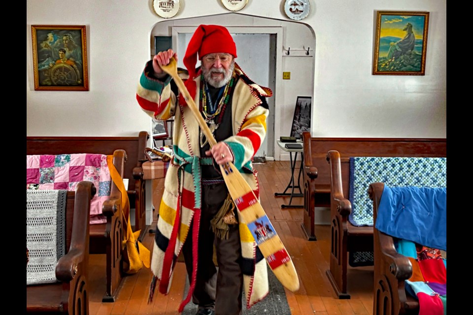 Greg Ingram, a professional public speaker for the Calgary-based Guns of the Golden West Association, gives an imaginary voyageur canoe paddling demonstration at the third annual Snow & Tumbleweeds winter festival held Jan. 20 at the Innisfail and District Historical Village. Johnnie Bachusky/MVP Staff