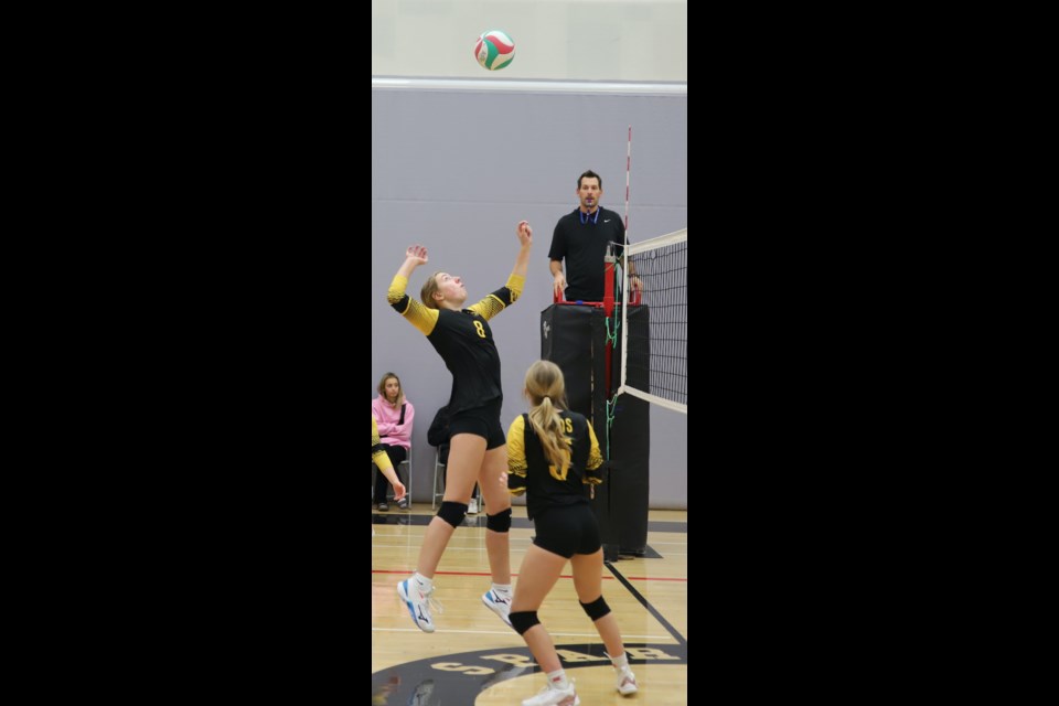 Avery Johnston of the Olds Spartans senior girls volleyball team leaps up for a spike during the league final Nov. 15.