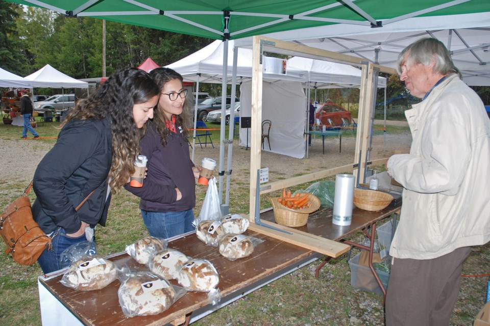 Calgary residents Carolina Feliu and her friend Carolina Villasenor -- both originally from Chile -- came to check out the vendors at the Bergen Farmers Market on Sept. 12, including Jamie and Laurie Syer's table.
Simon Ducatel/MVP Staff