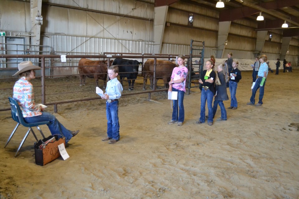 Young judges line up in the Calouri Pavilion during Summer Synergy to give their assessments to Jayden Calvert, Miss Rodeo Canada., far left.  