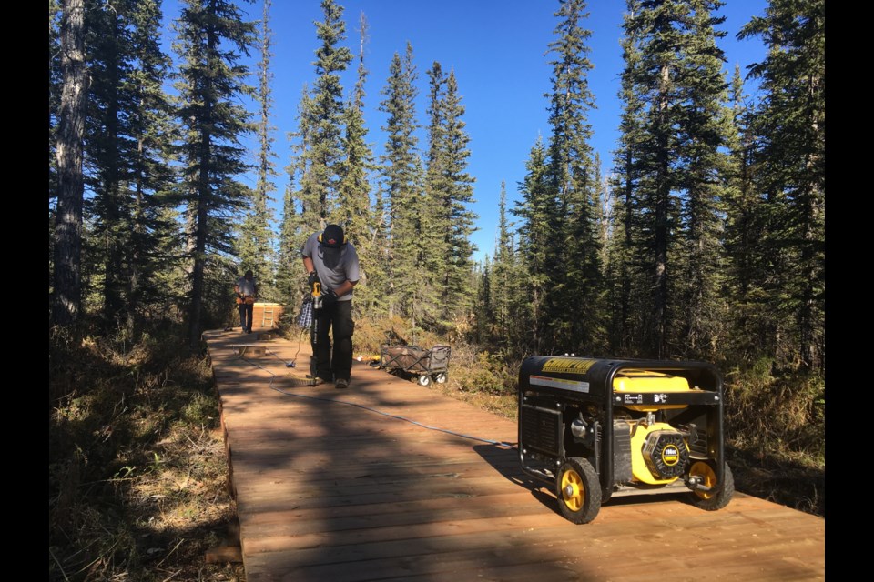 A generator, a wheelbarrow and an array of tools represent the heaviest equipment brought in by volunteers who were recently working to expand the interpretive nature boardwalk in the forested area behind the Sundre Visitor Information Centre. The decision was deliberately made to not bring in heavy equipment due to the sensitive nature of the area. 
Simon Ducatel/MVP Staff