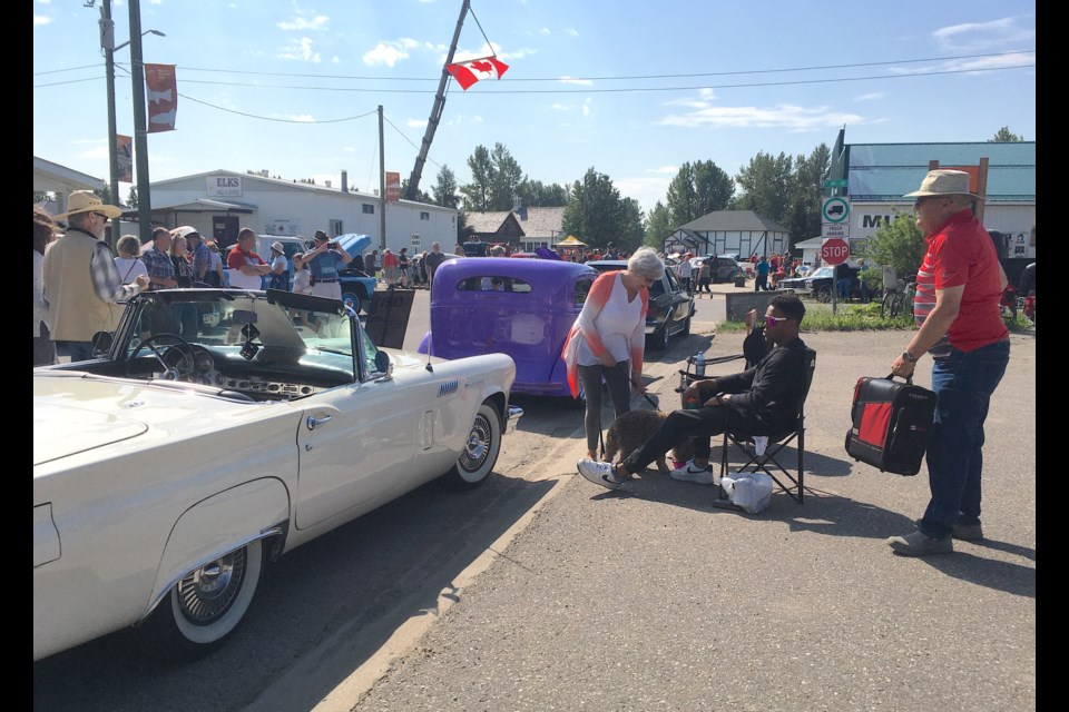 BIG CANADA DAY BIRTHDAY BASH IN SUNDRE — The Sundre & District Museum and its historic pioneer village grounds were packed on Canada Day as people came out in substantial numbers to celebrate the nation's birthday. The community event was hosted in partnership between the municipality and the Sundre & District Historic Society, and included activities such as a car show, outdoor music by Tim Hus, a free barbecue hosted by town council as well as family events like bag races. 
Simon Ducatel/MVP Staff