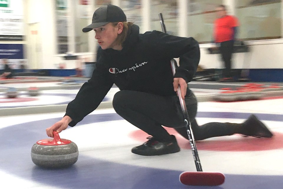 Sundre-area resident Ayden Shpak, who was playing with a rink with players from Bergen and Sundre that was skipped by Josh Shpak, gets focused on his target trajectory as he prepares to release a rock during games held on Saturday.
Simon Ducatel/MVP Staff