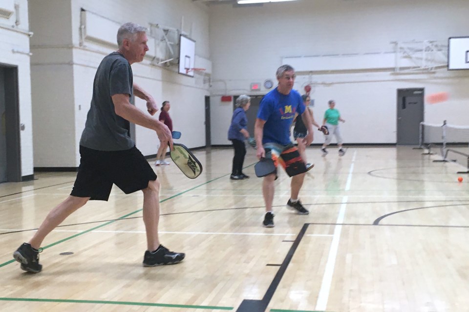 Sundre-area resident Bill Moulton, who has been playing pickleball for a few years, returns a service with teammate Rick Hertz in the background watching the play.
Simon Ducatel/MVP Staff