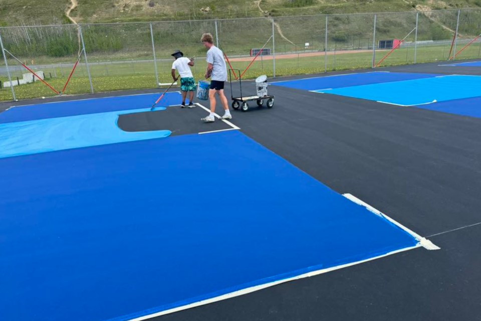 Work was recently completed on resurfacing the former tennis court behind Sundre High School with the latest design now dedicated exclusively for pickleball. Many comments posted on the Sundre Pickleball Association's Facebook page praised the project, but a few people wondered how the decision had been made to no longer include an option for tennis. 
Sundre Pickleball Association Facbeook