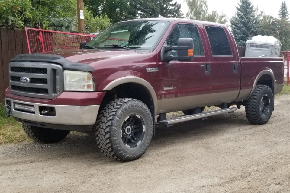 Sundre RCMP reported in a press release issued , Aug. 10, that this red F350 pickup truck – Alberta licence plate number CCC9599 – has been confirmed stolen from Olds and was suspected as being used earlier this morning in carrying out a coordinated fuel theft at a Sundre business at about 5:30 a.m. 
Image courtesy of Sundre RCMP