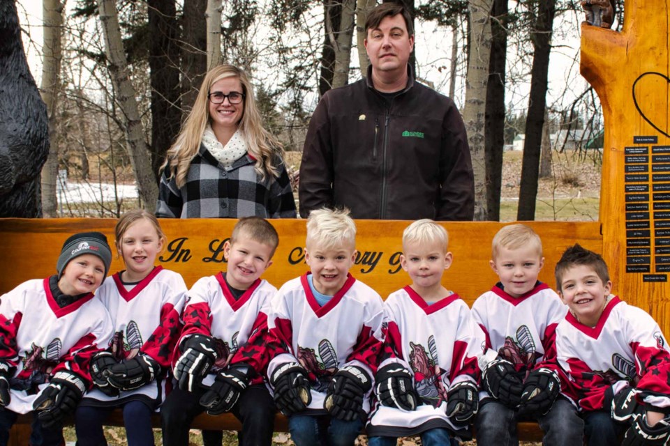 TIER 1 - Back row volunteers: manager Nicole Weatherbee and coach Bruce Alexander. Front row players: Dane Hansen, Arianne Alexander, Logan Wangler, Atticus Pettie, Sawyer Pettie, Ryken Bird and Lincoln Sklivas. Missing: coach Steve Pettie.
