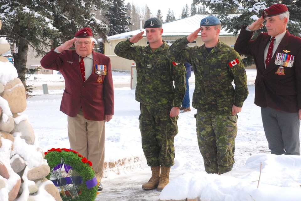 THREE GENERATIONS — From left, Sundre resident Gerry Vida, accompanied by his grandsons Aidan Vida and Taylor Vida, from Red Deer, as well as his son Shandy Vida, right, joined a physically-distanced crowd of more than two dozen people who paid their respects to Canada’s veterans and fallen during a minute of silence at the Veterans’ Homecoming Park cenotaph in Sundre on Nov. 11.
Simon Ducatel/MVP Staff