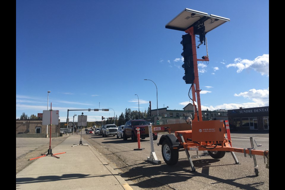 A temporary traffic light has been installed immediately west of the intersection of Sundre’s Centre Street with the Highway 27-Main Avenue corridor as construction began Sunday, Sept. 24 on the municipality’s upgrades to underground infrastructure ahead of Alberta Transportation’s long-anticipated overlay project that is now scheduled to begin next year. 
Simon Ducatel/MVP Staff