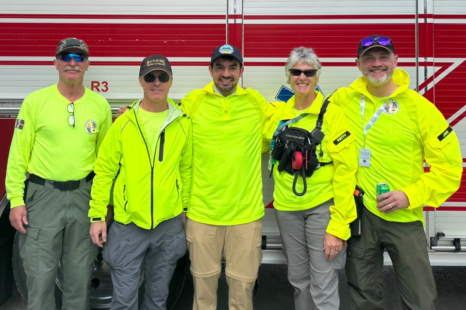 Five members of the Sundre Volunteer Search and Rescue Society were among 16 teams from across Alberta that participated on May 3-4 in a multi-agency mock wildfire evacuation exercise hosted by Hinton SAR.
From left: Ihor Holowczynsky, director of training; Ken Taylor,
director of special projects; Noah Bradley, director of technology; Patty McCallum, secretary; and 
Jon Allan, director of public information. 
Photo courtesy of Sundre Search and Rescue