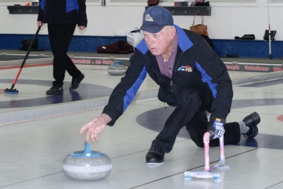 Sundre Curling Club seniors’ league rep Les Waldroff demonstrates on Tuesday, Jan. 4 impressive form as he releases a rock during the first games of the season, which as a result of COVID-19 complications was postponed until the new year. All of the sheets were busy with eight teams from the seniors league who came out eager to play. Simon Ducatel/MVP Staff 