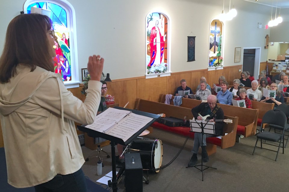 Theresa Wasden, who conducts both the Olds Community Chorus as well as the Messiah Choir, was invited by the Sundre Community Choir’s manager to lead a fun, informal class both introducing aspiring vocalists to the basics while also offering choir members a chance to practise by learning the words to and singing the Beatles’ classic tune Here Comes the Sun.  
Simon Ducatel/MVP Staff
