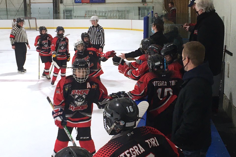 The Sundre U13 Huskies celebrate scoring on Friday evening their first goal barely five minutes into first period play of the tournament’s opening game against the Cochrane Rockies at the Sundre Arena. 
Simon Ducatel/MVP Staff
