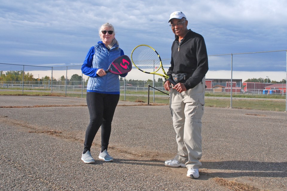 Longtime Sundre residents Brenda Salsman and Anton Walker met up at the tennis court behind the Sundre High School on Friday, Sept. 25. Salsman recently started raising funds with the goal of resurfacing the court in the spring. 