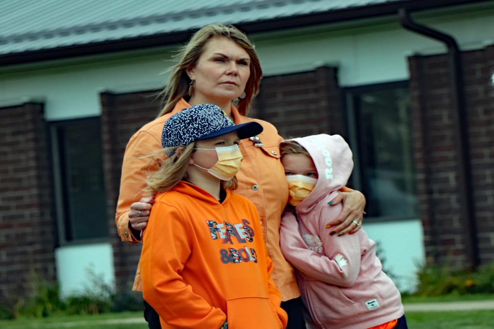 Innisfail mother and school teacher Janelle Carey brought her two children - son Cooper (lower-left) and daughter Molly - to the local ceremony for the National Day for Truth and Reconciliation. Johnnie Bachusky/MVP Staff