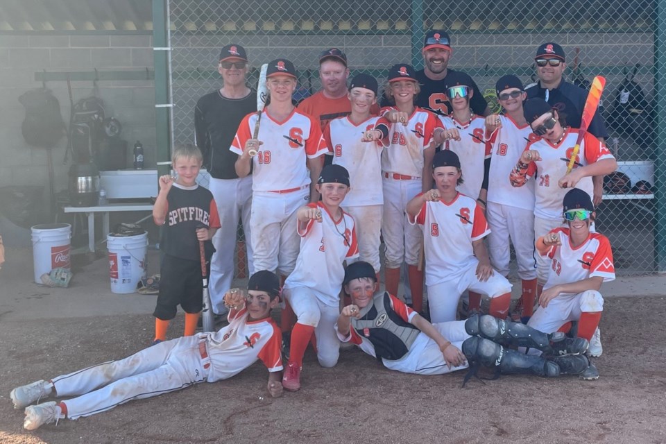 Members of the U13 Black Olds Spitfires celebrate after winning their division durng the fourth annaul Spitfires Classic baseball tournament, held June 27-30 in Olds.
Photo submitted