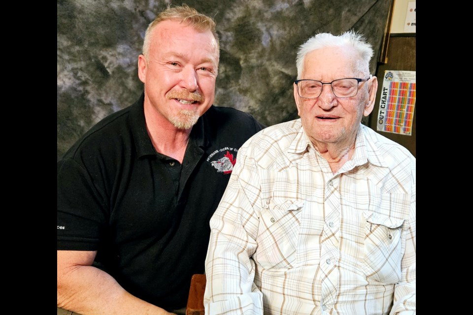 Veterans Voices of Canada founder Al Cameron poses with 99-year-old military veteran Peter Kraft. 