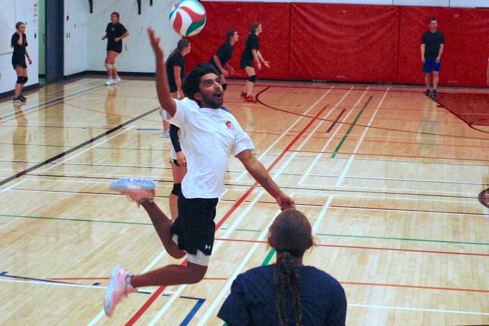 Oliver Klassen leaps up for a smash on Tuesday, Aug. 26 during the second and final day of an inaugural volleyball camp at Sundre High School. Simon Ducatel/MVP Staff