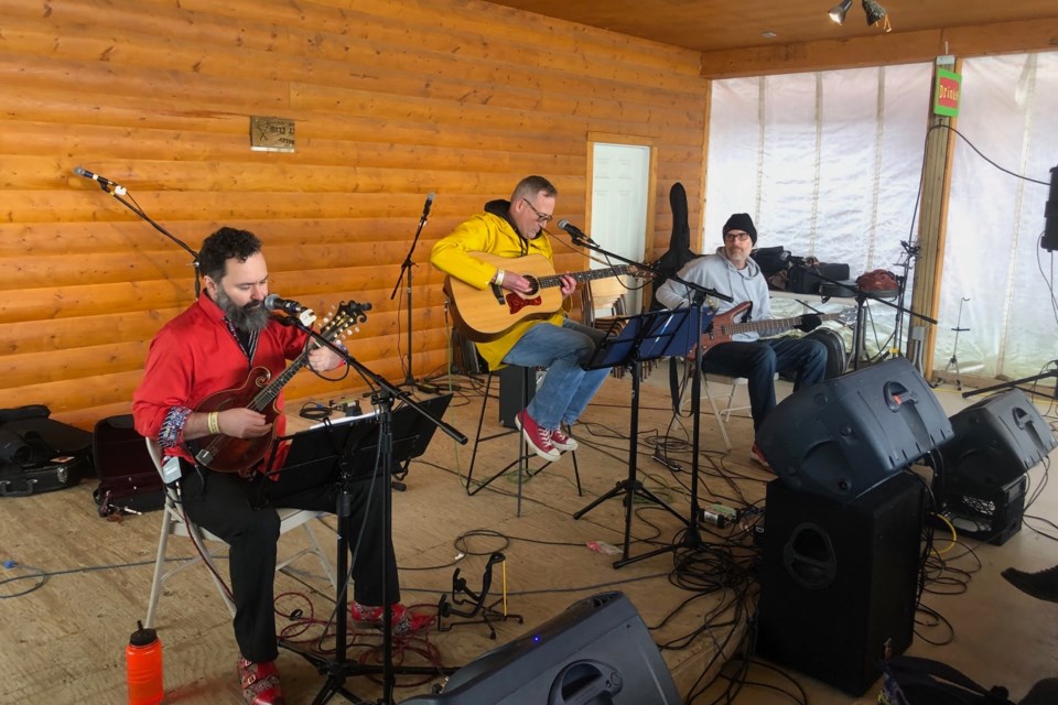 Musicians perform in the Settle In tent during the Water Valley Arts & Music Festival on June 21.