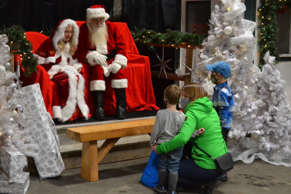 Mandy Moran who lives near Didsbury and children Grayson and Owen visit with Santa and Mrs. Claus during Olds Winter Wonderland on Nov. 22. 
Doug Collie/MVP Staff