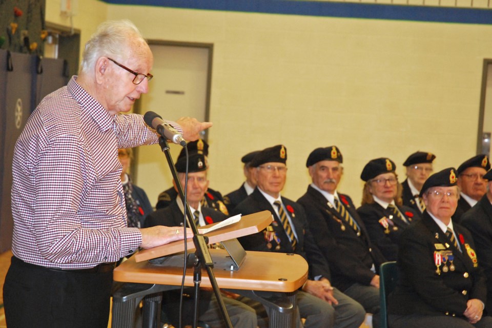 Neil Vanderzwan, 86, a resident at the Mountain View Seniors' Housing lodge in Sundre, was just a boy when Nazi Germany invaded and occupied his home country of Holland. He shared some of his experiences with more than 400 people gathered at River Valley School on Monday, Nov. 11 during the community’s annual Remembrance Day service. 