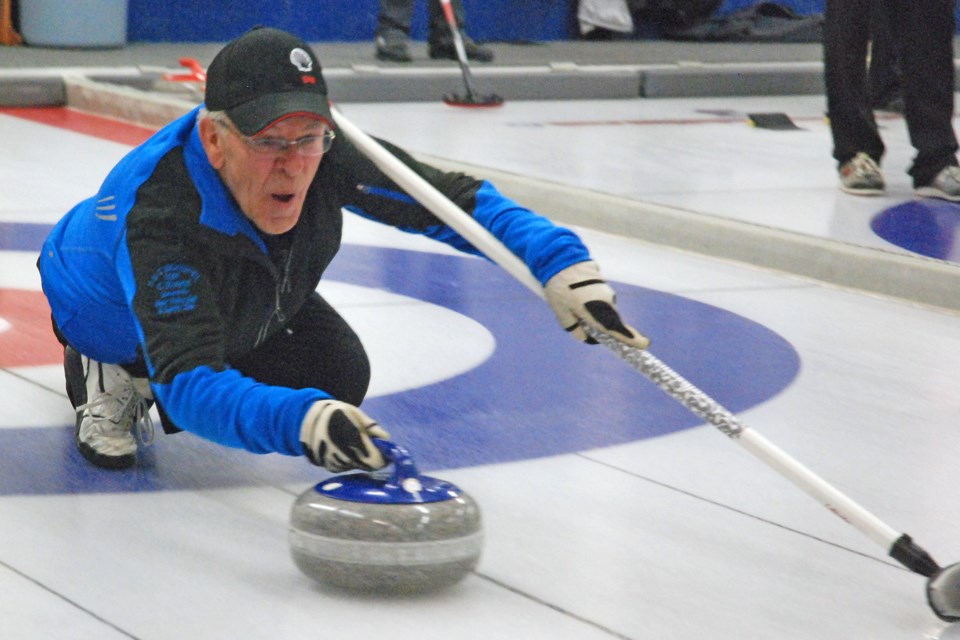 Skip Barry Rock, from Water Valley, focuses intently as he prepares to release a rock on Friday, Dec. 6 during the Sundre Curling Club's seniors' bonspiel C event final. 
Simon Ducatel/MVP Staff