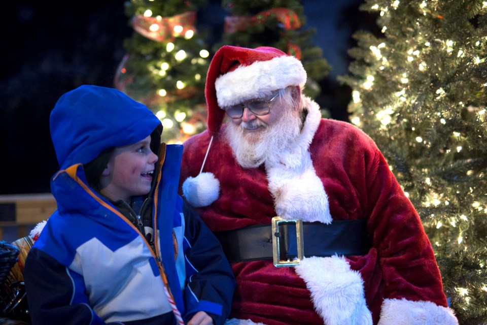  Jack Butters was among many children who came out on the evening of Friday, Nov. 29 during Sundre Snow Fest to visit with Santa Claus. Jolly St. Nick  brought his sleigh along with him to the Greenwood Campground's new community gazebo, which was colourfully decorated and lit up for the Christmas season. 
Noel West/MVP Staff