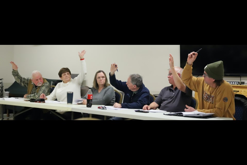 Bowden Municipal Planning Commission (and town council members) vote to turn down the application for an apartment building downtown, rejecting the request to cut the number of parking spaces. From left are coun./MPC member Wayne Milaney, Sandy Gamble, Marie Flowers, Paul Webb, mayor Robb Stuart and Randy Brown.