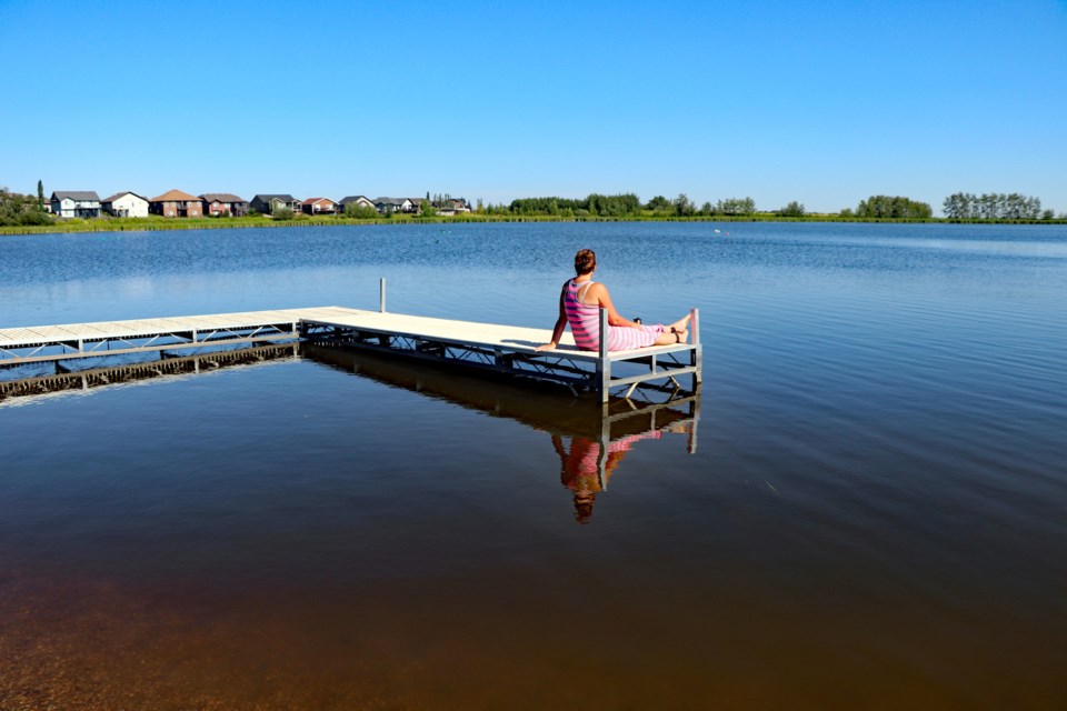 A citizen relaxing at Dodd's Lake's boating dock. It's expected this area will be enhanced once council approves the new vision for the lake in early 2021.  Johnnie Bachusky/MVP Staff