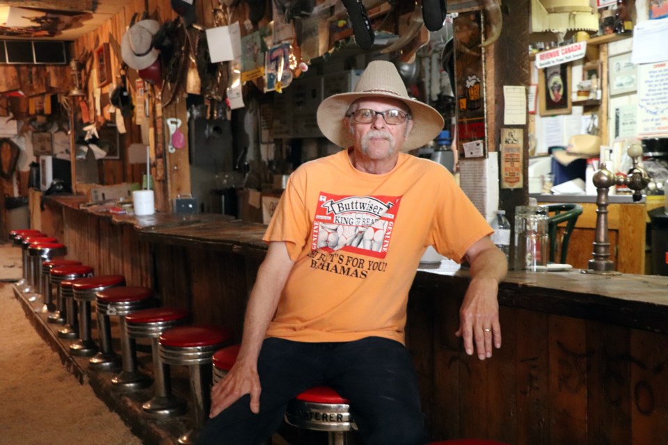 Doug Hampton, the caretaker of Rowley, takes a break inside Sam's Saloon. Although Pizza Night has been shut down due to the COVID-19 pandemic, he is confident the ghost town — now a revered tourist destination — will soon be back to normal. Johnnie Bachusky/MVP Staff