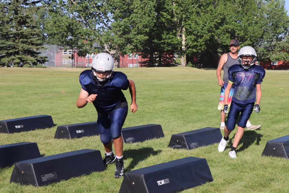 With the first game of the season coming up, players with the Olds Huskies peewee football team are practising hard for their upcoming five-game exhibition season against the Innisfail Cyclones. Johnnie Bachusky/MVP Staff