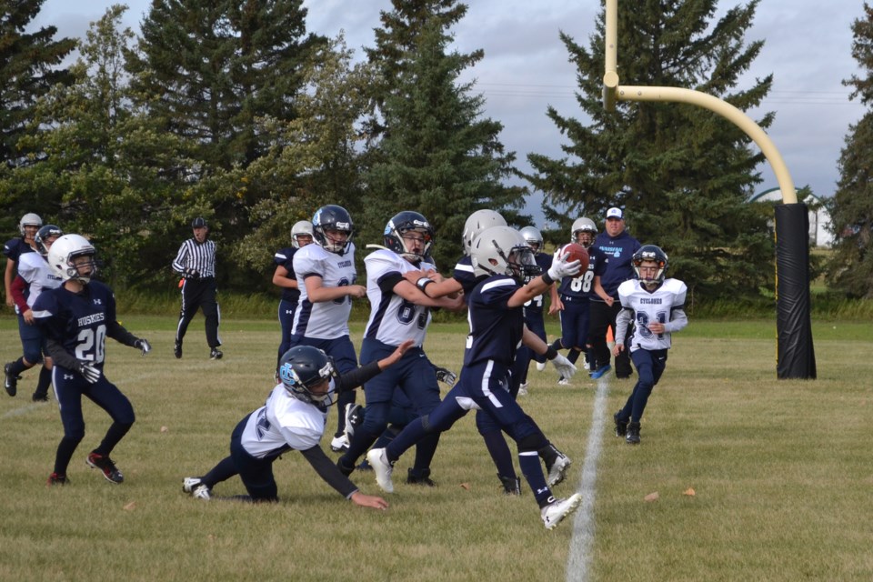 The Innisfail Cyclones were unable to keep Ethan Pedersen (2), of the Olds Huskies, out of the endzone on this play during a peewee football game Sept. 12 at Normie Kwong Field. Doug Collie/MVP Staff