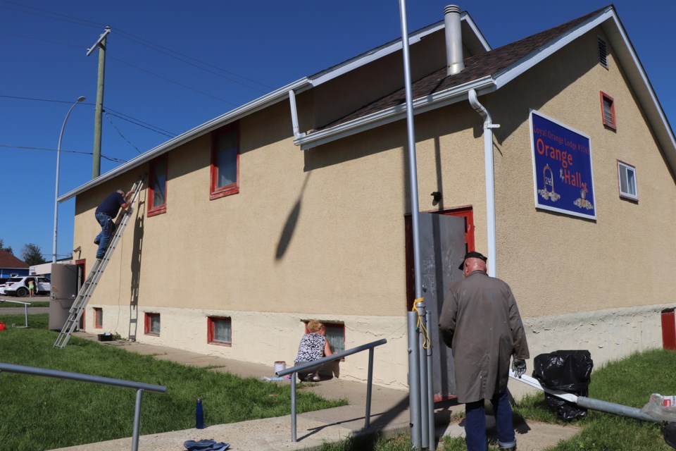 WEB Orange hall outside workers