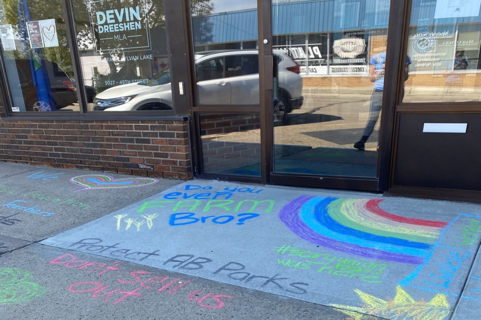 Chalk Protest drawings on Aug. 21 in front of the Innisfail office of MLA Devin Dreeshen.  Submitted photo
