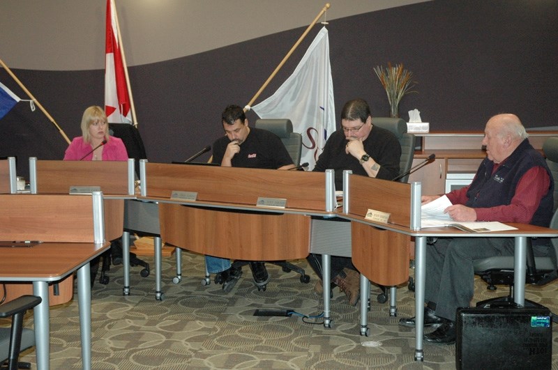 Mayor Annette Clews, left, speaks with councillors Chris Vardas, Tony Jordan and Myron Thompson during last week&#8217;s special council meeting.