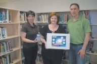 Fortis officials presents donation to library staff