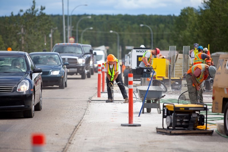 Crews work in the Red Deer River Bridge