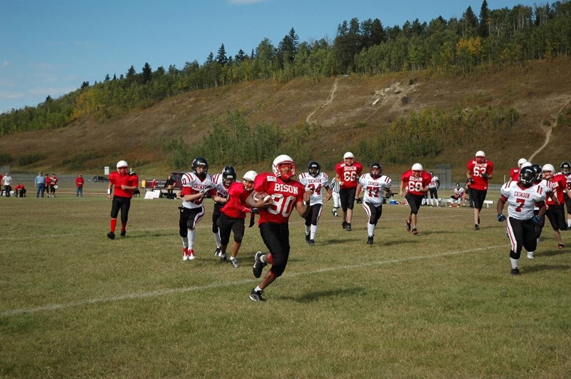 Andre Thompson runs for Sundre&#8217;s first home touchdown of 2012 on Saturday.