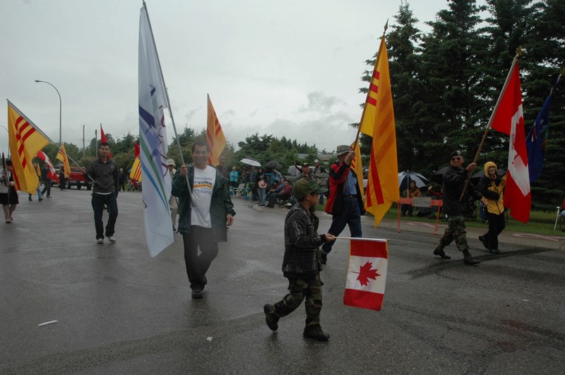 Supporters carry Republic of Vietnam flags during the 2012 Sundre parade.