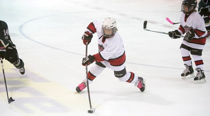 Ryan Rosevear of the Sundre atom B Huskies attempts a shot during the team&#8217;s game against Ponoka at the Sundre Arena on Saturday, Jan. 2.,