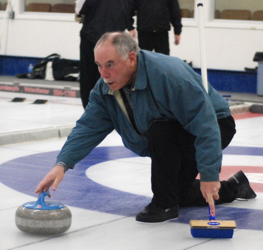 EYES ON THE PRIZE ó Skip Rick Smee, from Sundre, releases a rock on Friday, Dec. 11 during the C event final of the annual 50-plus bonspiel. He played with Lila Weiss,