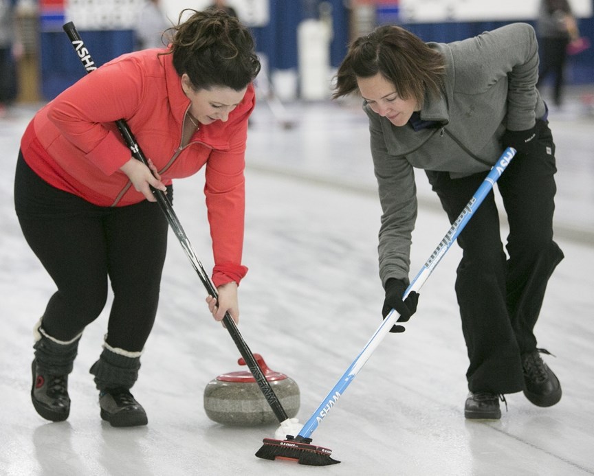 LADIES COMPETE IN ANNUAL BONSPIEL ó Kristy Willick, left, and Dani Rock sweep a rock during the ladies&#8217; bonspiel at the Sundre Curling Club on Saturday, Feb. 13. There