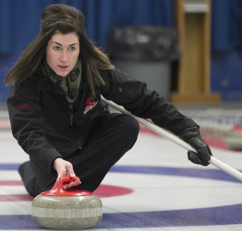 MIXED BONSPIEL ó Carolyn Gleeson throws a rock during the mixed bonspiel at the Sundre Curling Club on Friday, Jan. 22. The event, which hosted 12 teams, continued until
