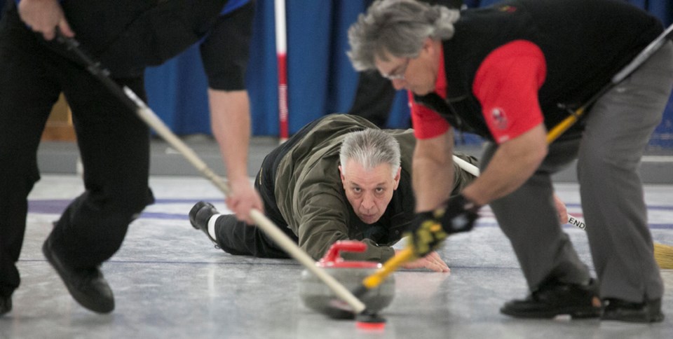 SMOOTH DELIVERY ó Steve Knapp releases a rock during the 28th annual Sundre Oilmen&#8217;s bonspiel at the Sundre Curling Club on Friday, March 4. The event ran until Sunday, 