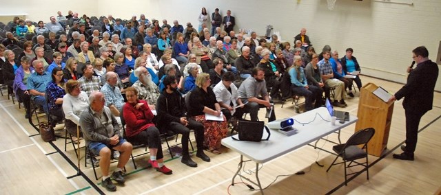 About 150 people gathered last Thursday evening at the Sundre Community Centre for a public meeting organized by MLA Jason Nixon, pictured right, and his staff to hear a