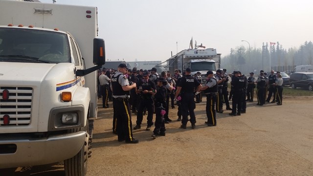 RCMP officers would meet for a briefing in the mornings before heading out to canvas neighbourhoods and search for anyone who might need assistance.,