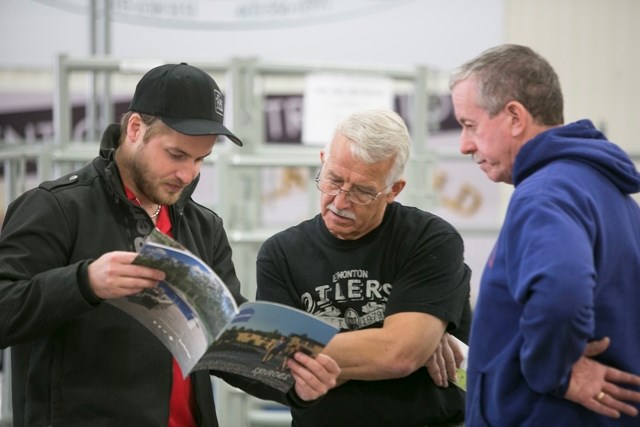 From left, Home Hardware representative Josh Hengen speaks with Bob Green and Gord Rutherford during the inaugural Explore Sundre Adventure and Home Expo at the Sundre Arena